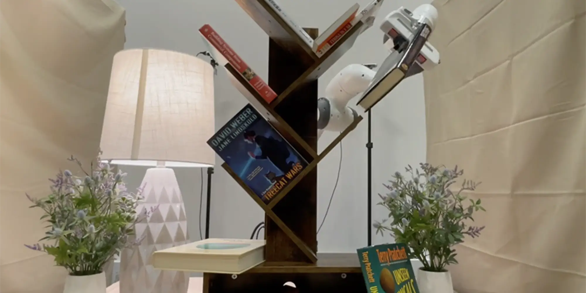 Books on a tilted shelf