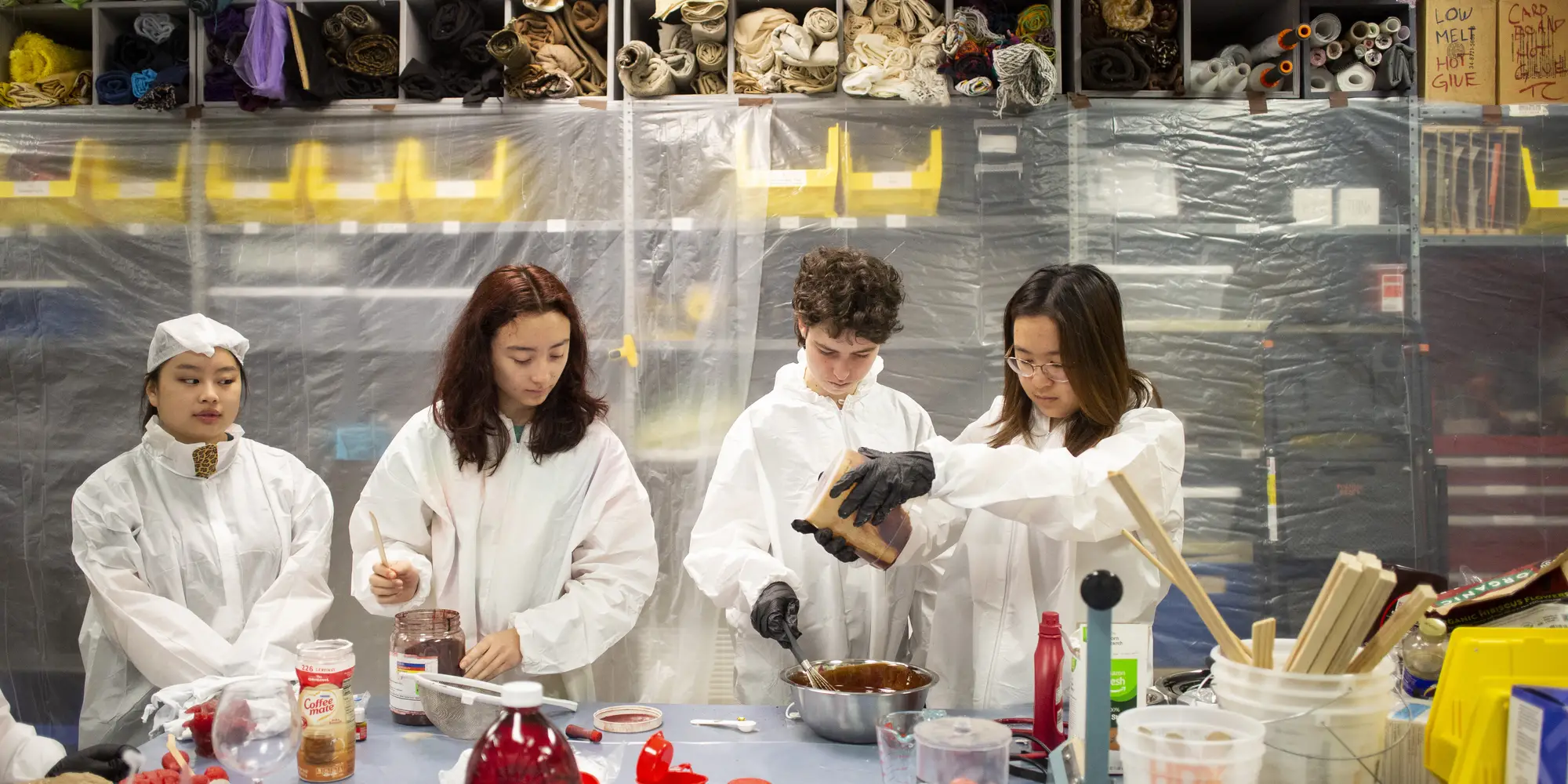 Pre-college students mix prop blood.