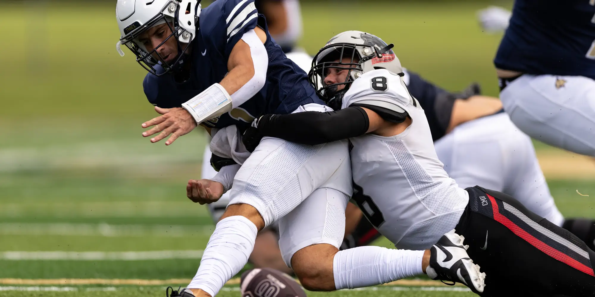 Robert Coury tackles a player.