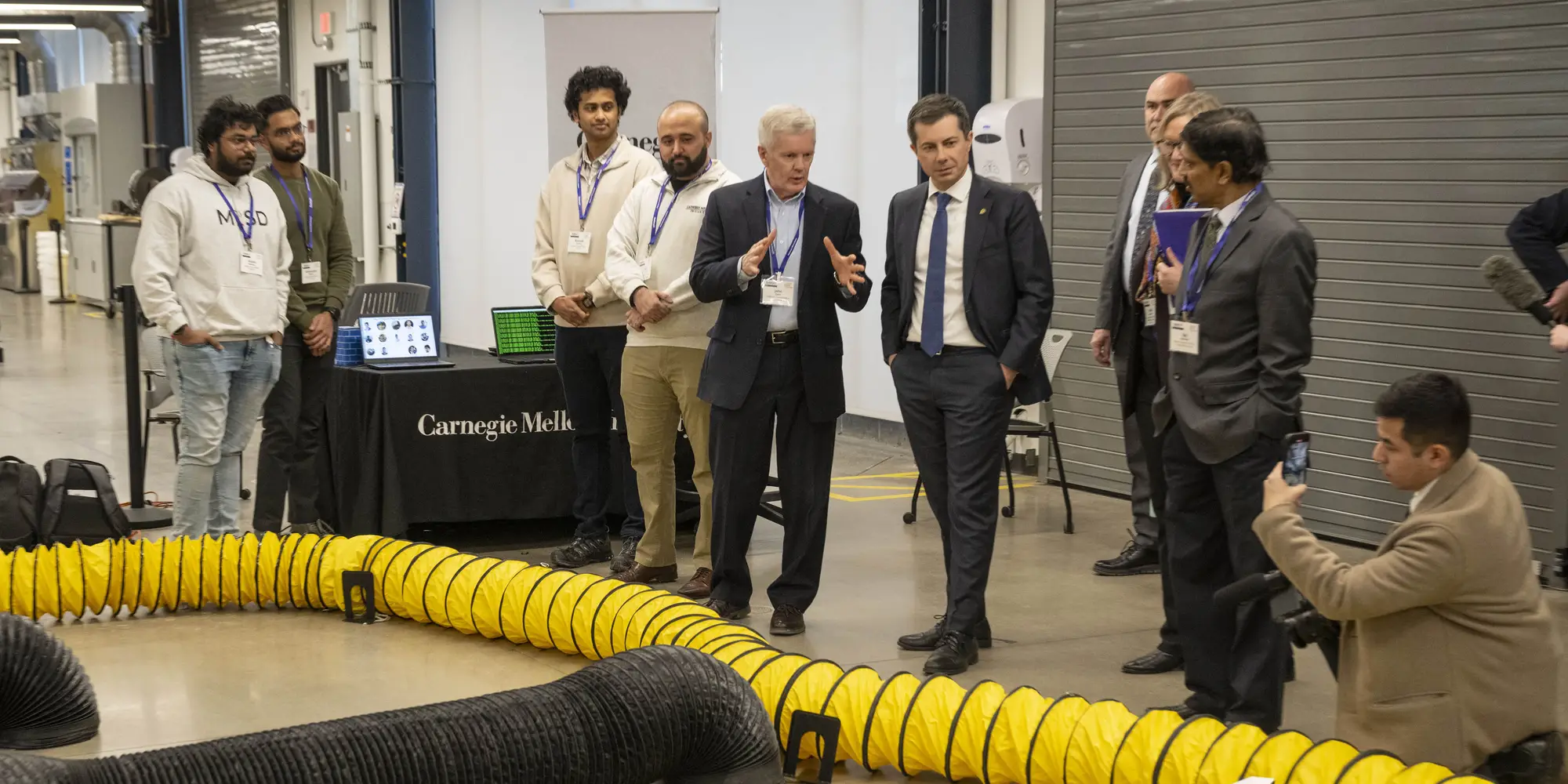 John Dolan, principal systems scientist at the Robotics Institute, demonstrates the F1Tenth Autonomous Racing Course to U.S. Secretary of Transportation Pete Buttigieg