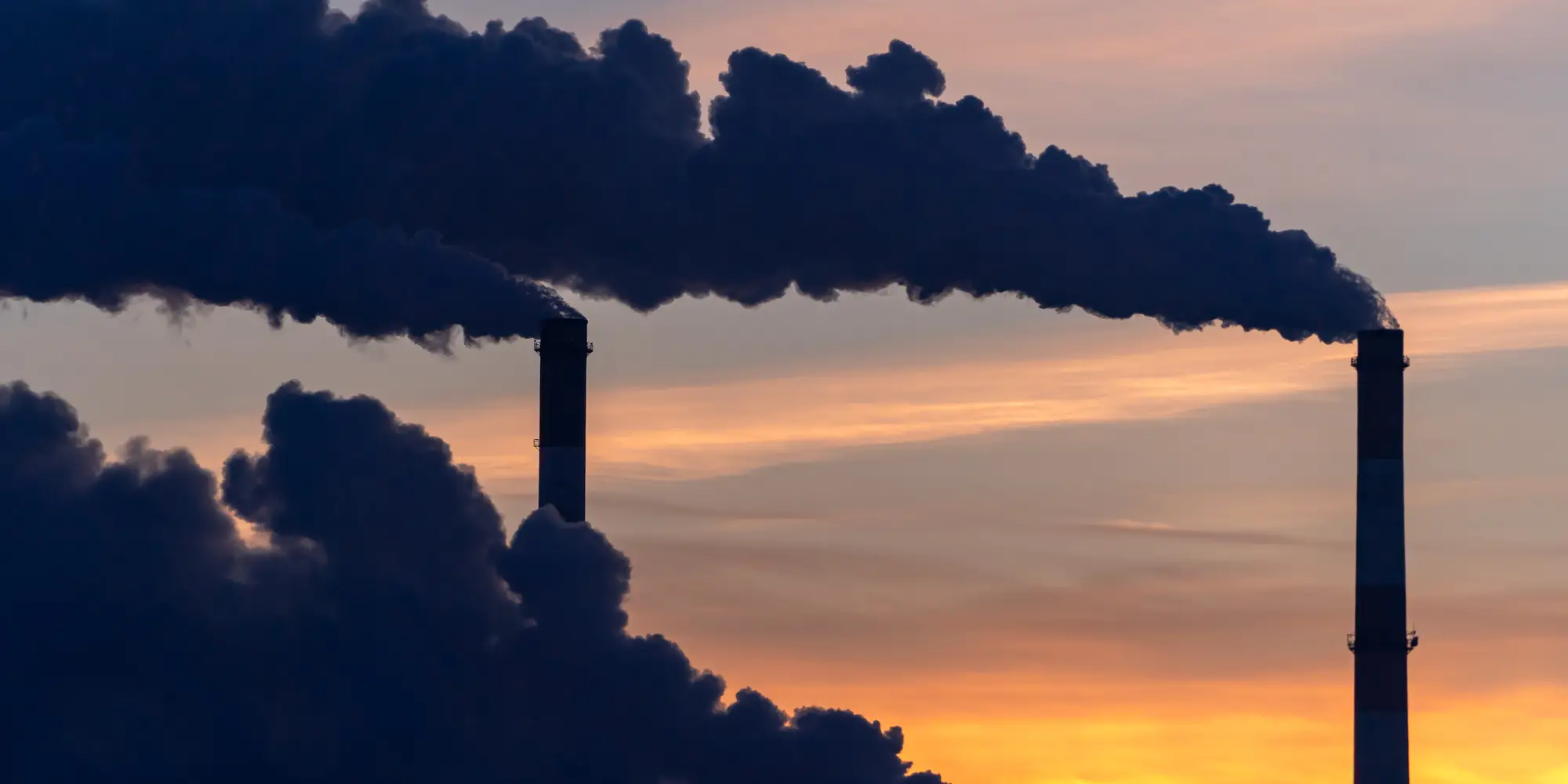 Smoking industrial zone factory chimneys.