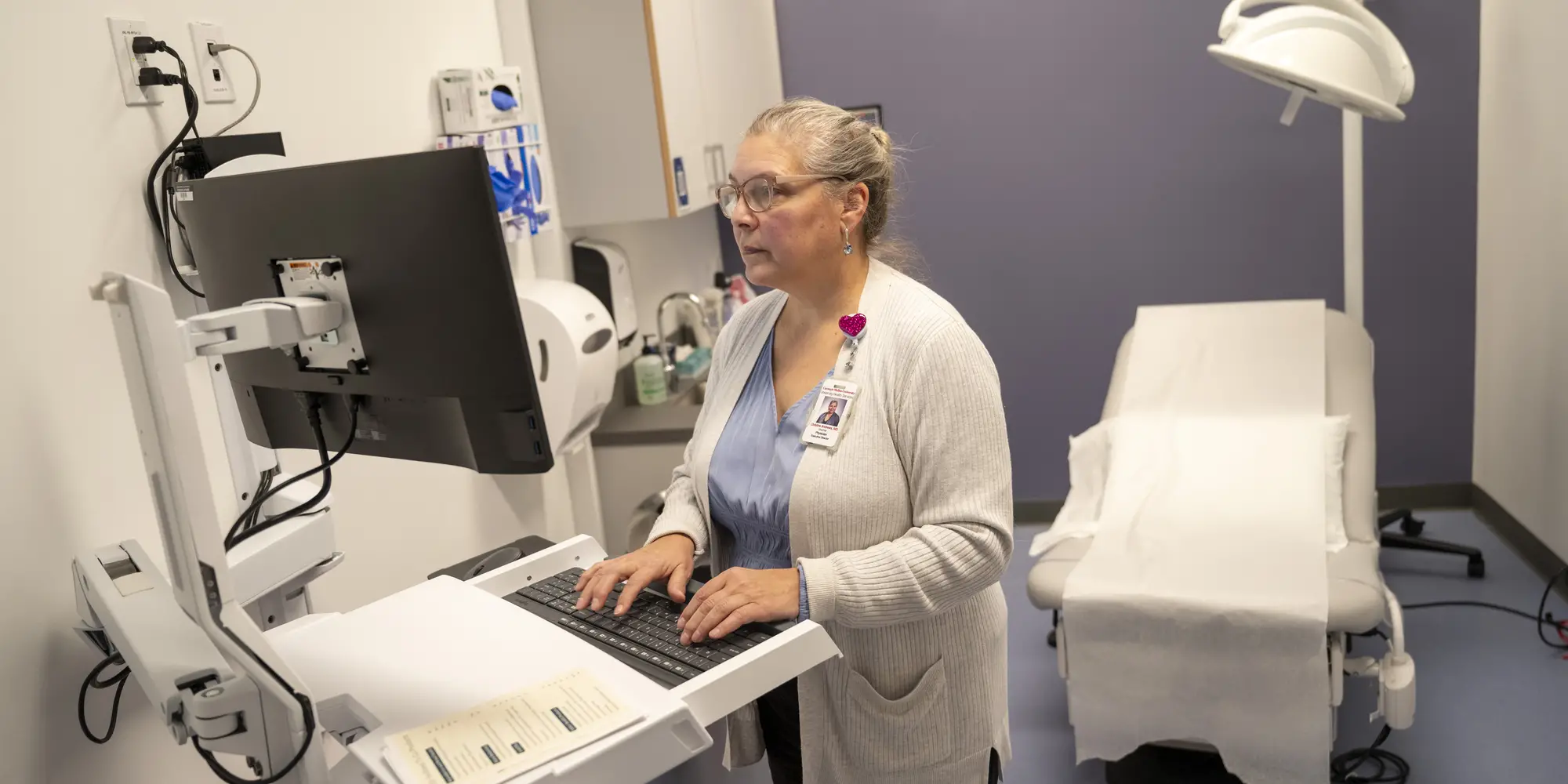 Dr. Andrews working in exam room