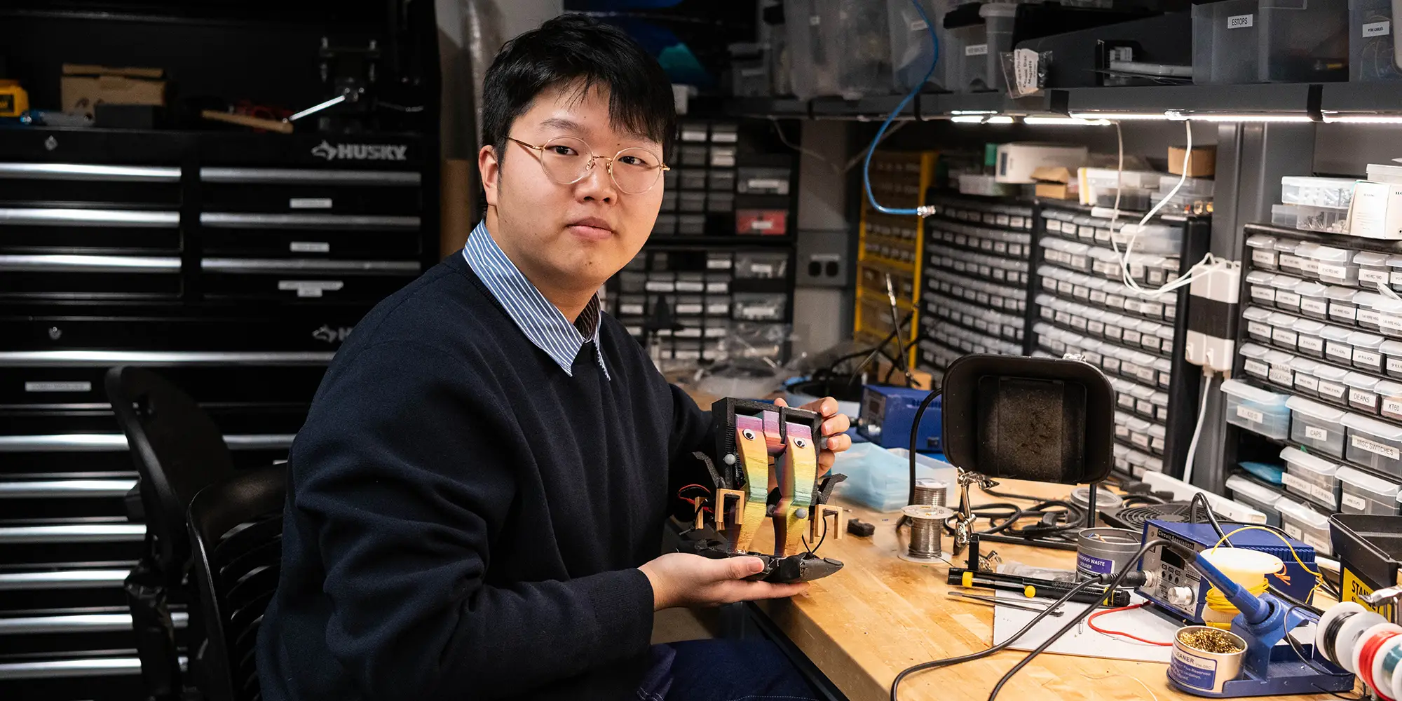 Ben Gu with a small biped robot