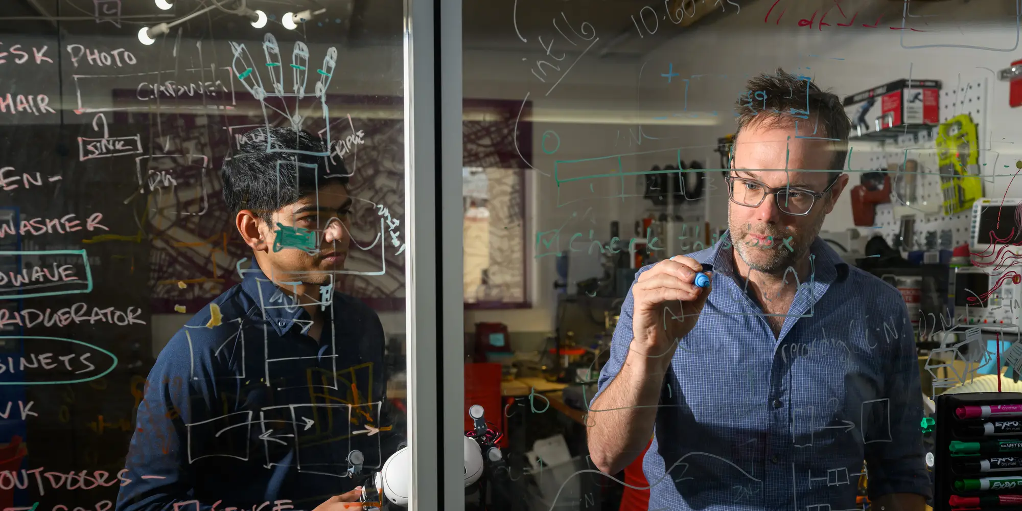 HCI professor Chris Harrison instructs a student.
