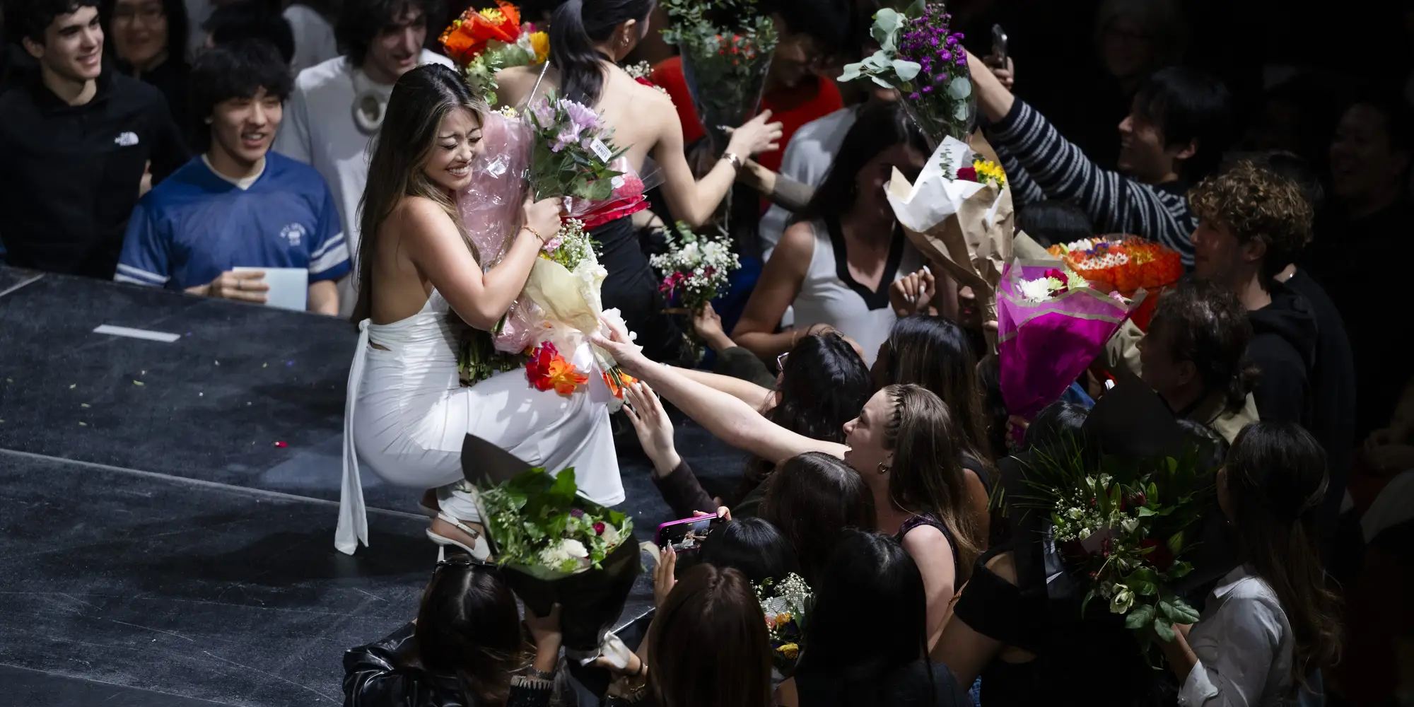 Designers receive flowers from the crowd at Lunar Gala