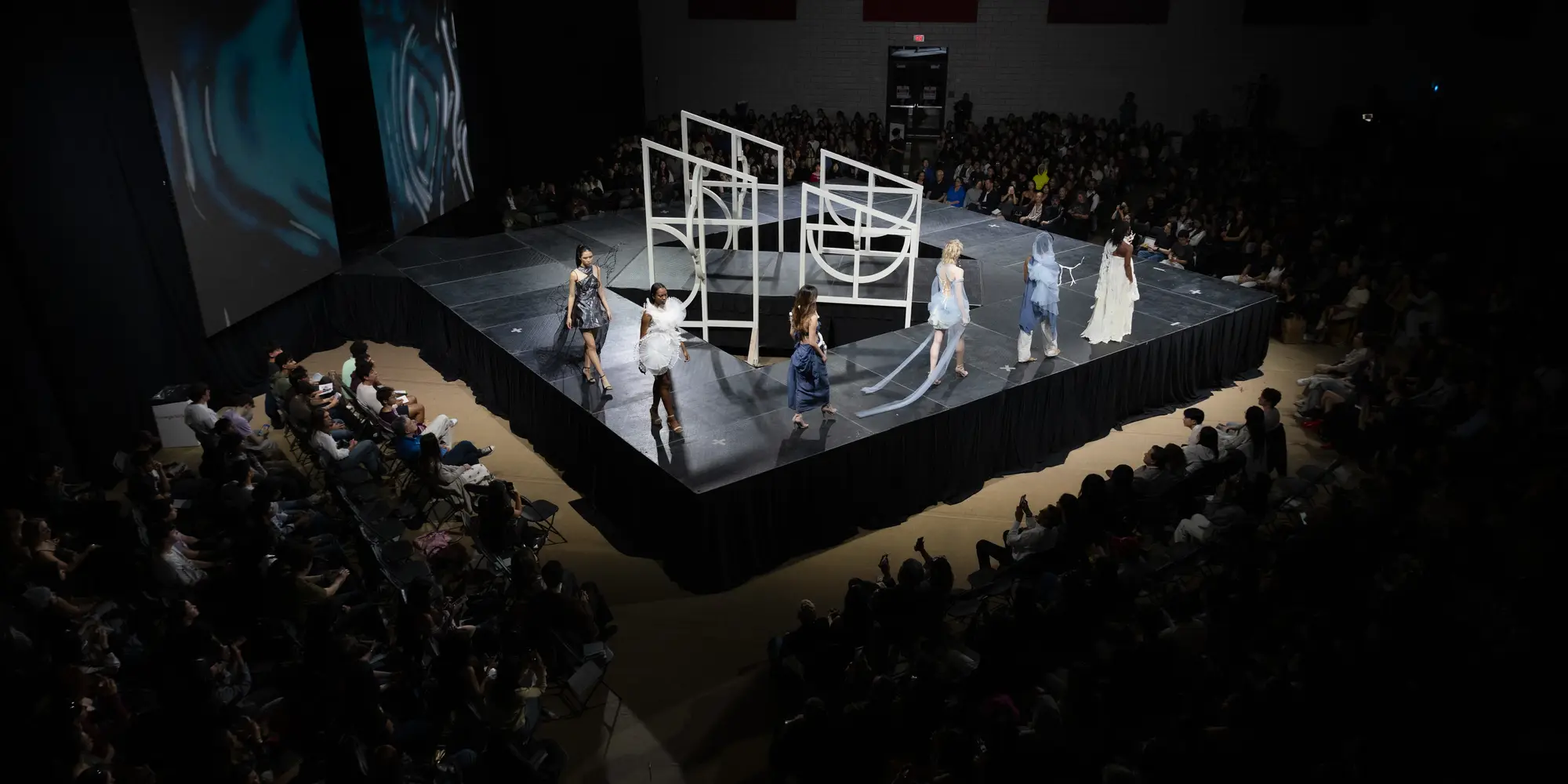 Models walk around the Lunar Gala runway, which is shaped like a diamond