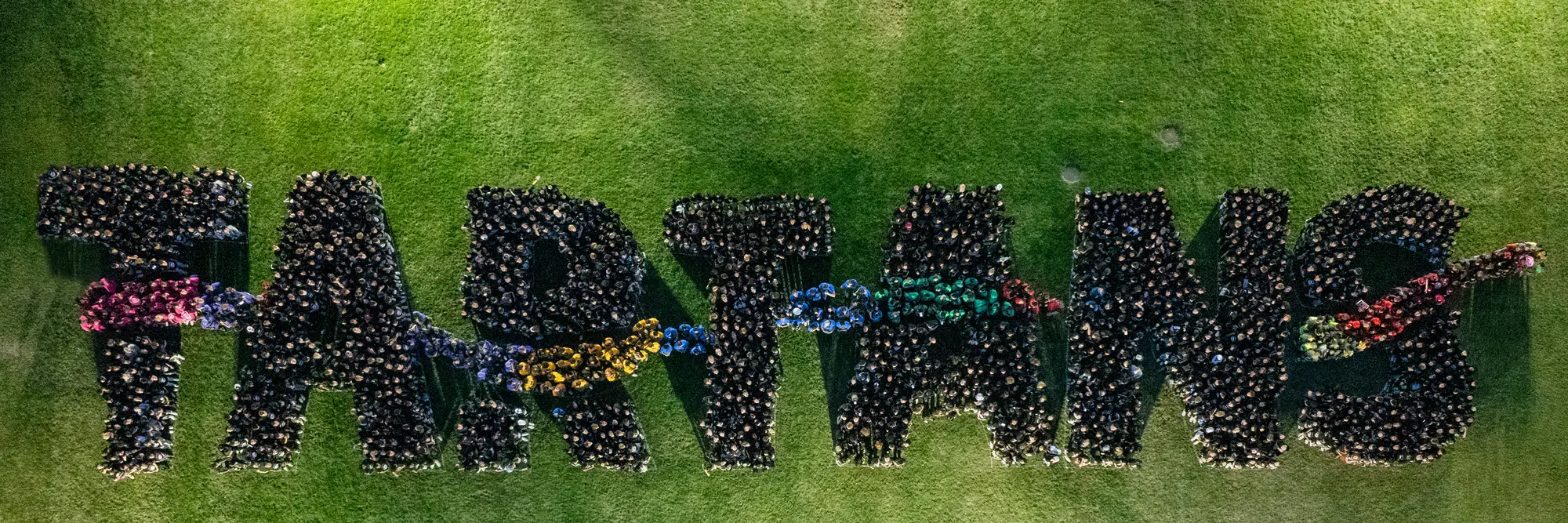 The Class of 2028+ spells the word "Tartans" in their class photo.