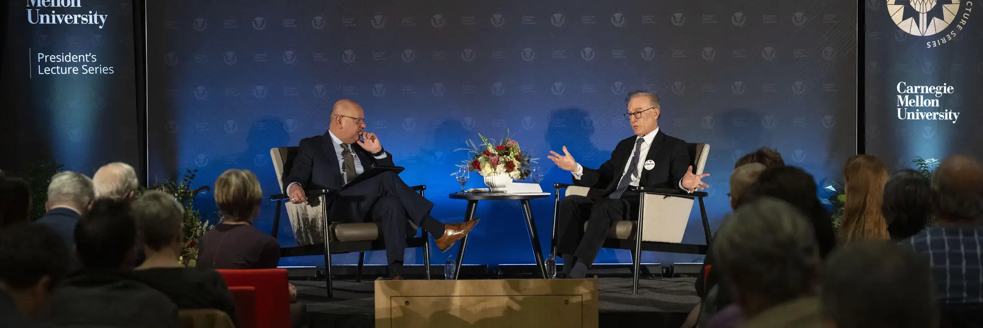 Farnam Jahanian and David Ignatius speak together on stage.