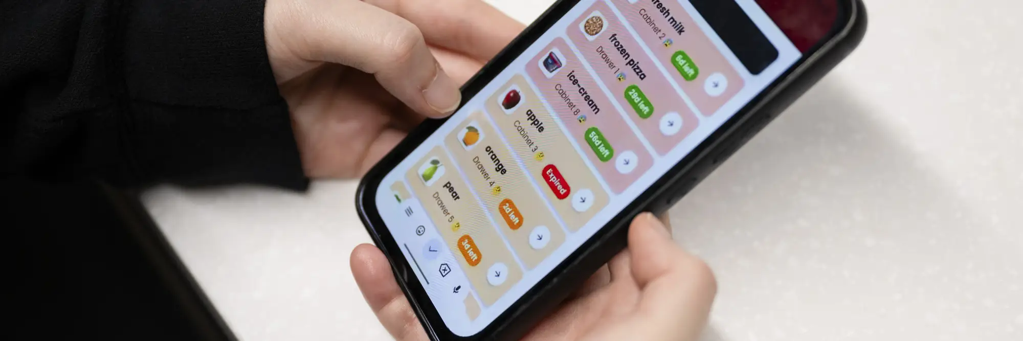 two hands holding mobile phone showing app