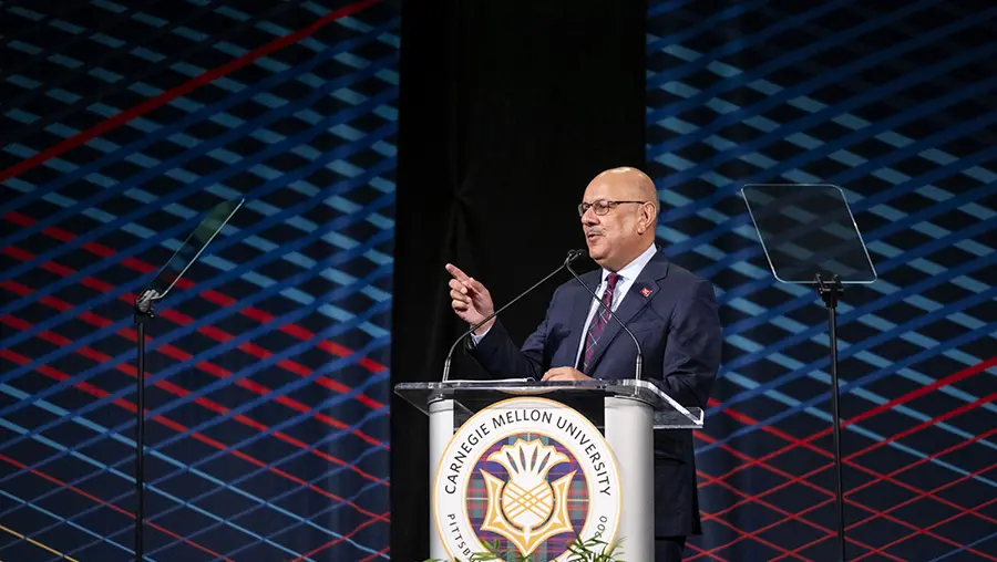 CMU President Farnam Jahanian at podium