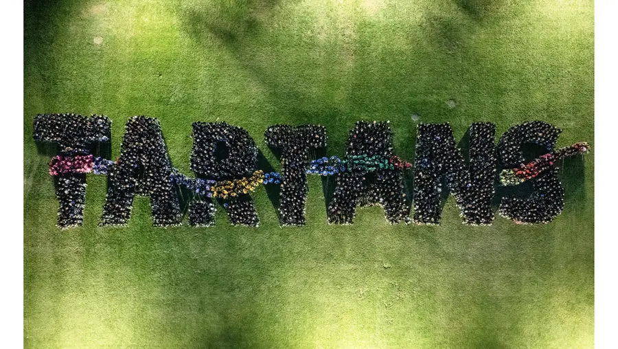 The Class of 2028+ spells the word "Tartans" in their class photo.