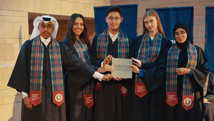 Representatives from the Class of 2028 receive the class tile at the First-Year Convocation.