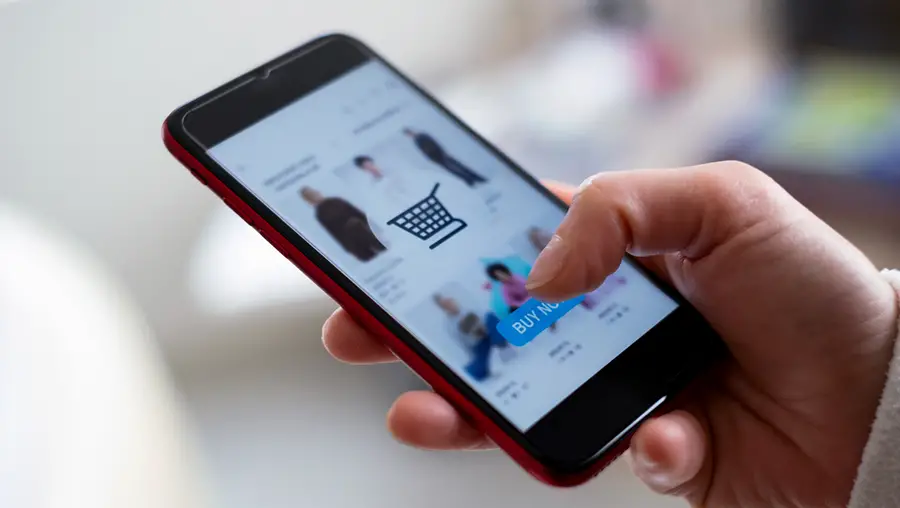 Person shopping online via their phone.