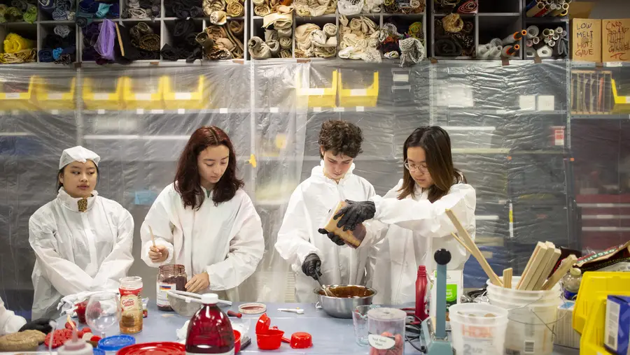 Pre-college students mix prop blood.