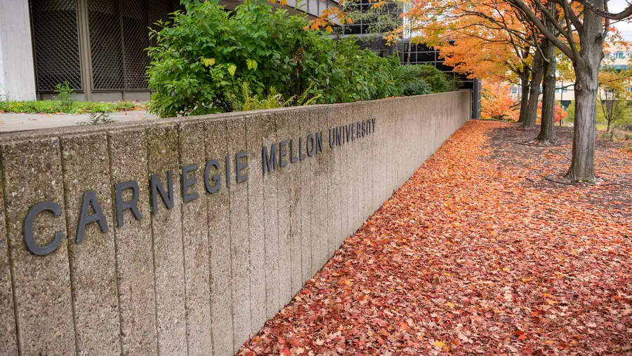 Carnegie Mellon University sign with fall leaves