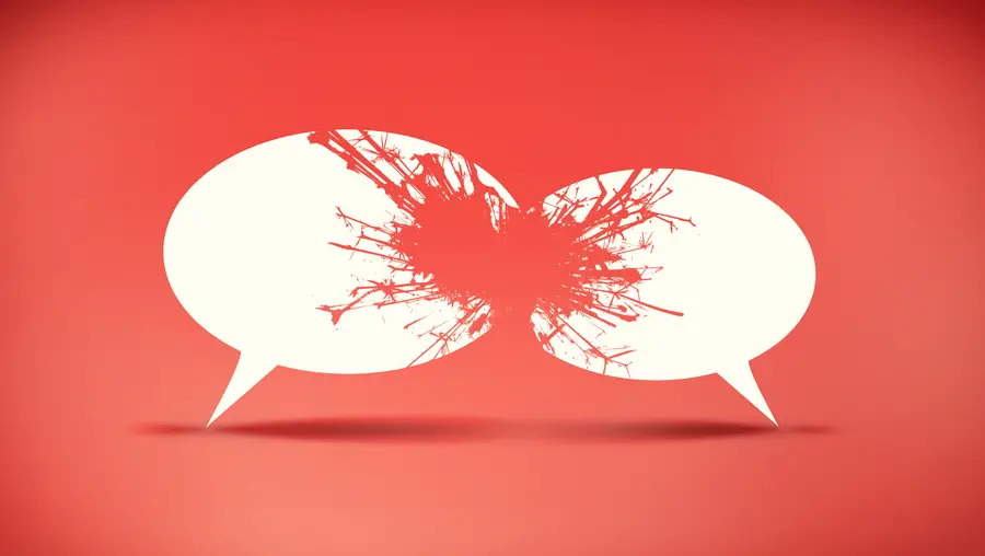 Two cartoon speech bubbles clash as if to shatter against a red background