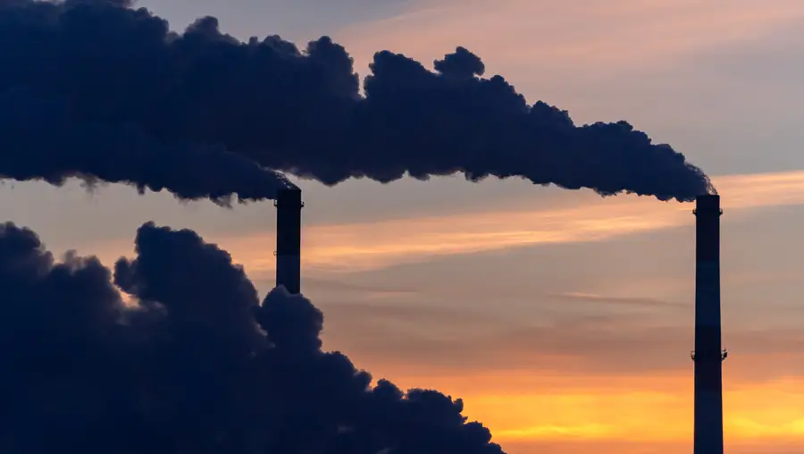 Smoking industrial zone factory chimneys.