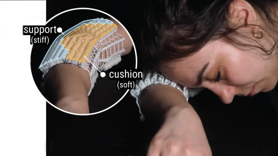 A woman sleeps with her head resting on her arm while wearing a special armband that adjusts its softness and support.