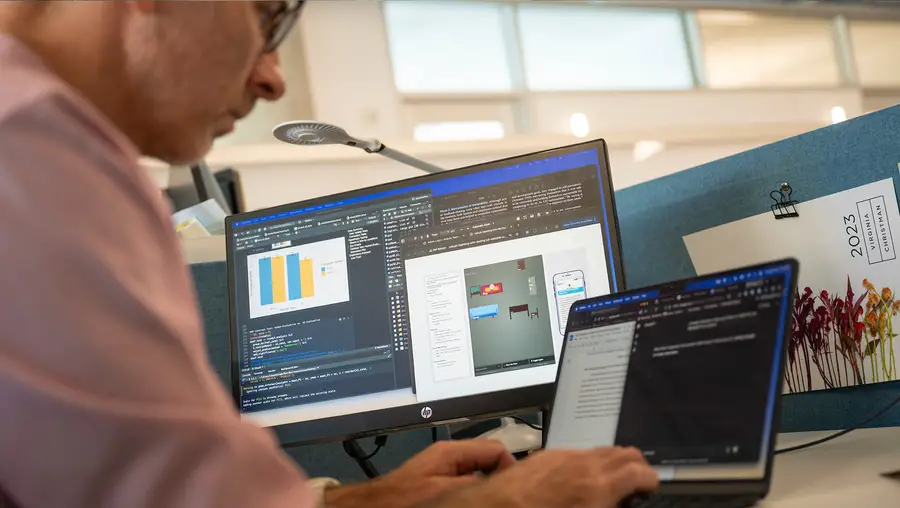 Ph.D. student Allen Brown works on a laptop.