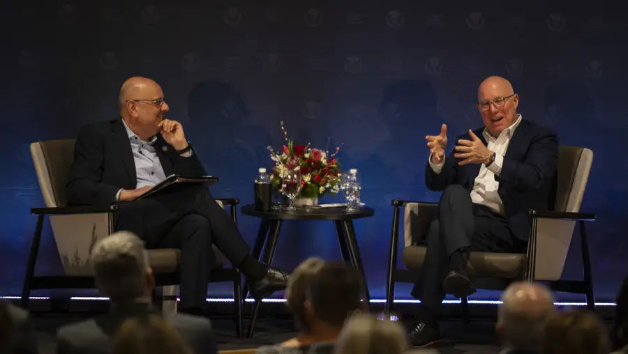 Farnam Jahanian talks onstage with Ted Decker. 