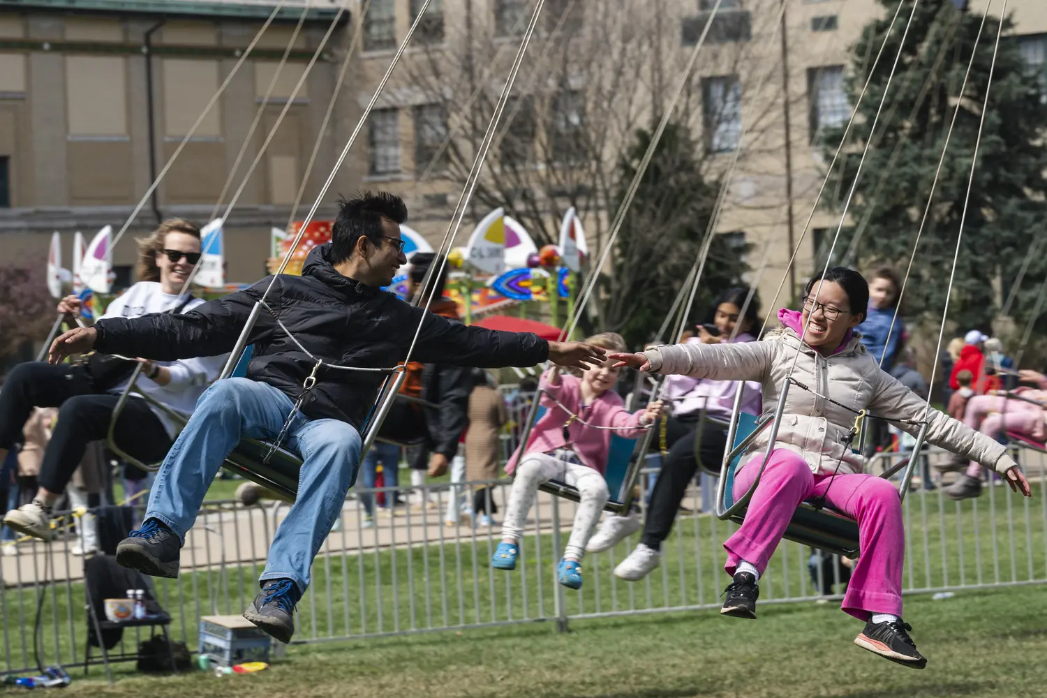 People enjoying Carnival swing ride.