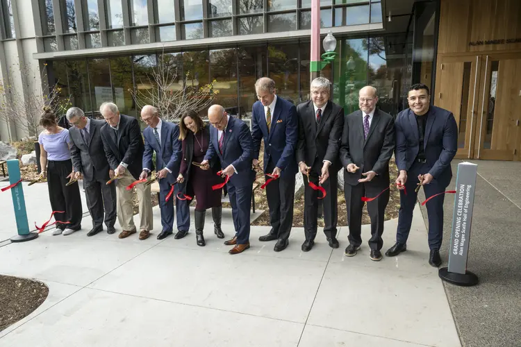 A ribbon cutting at Scaife Hall