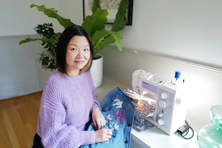 Ming Ming Chapman at sewing machine showing embroidery