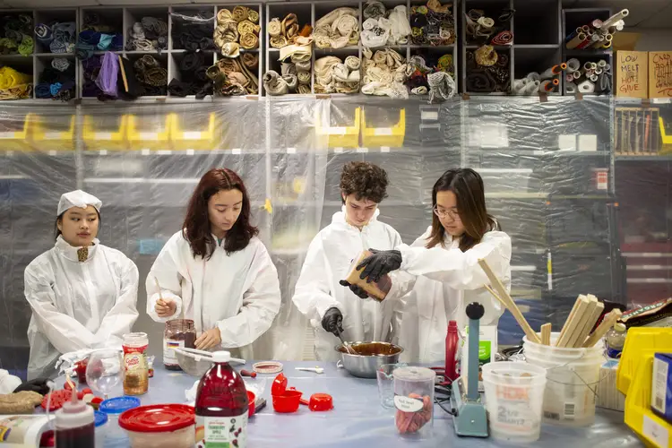 Pre-college students mix prop blood.