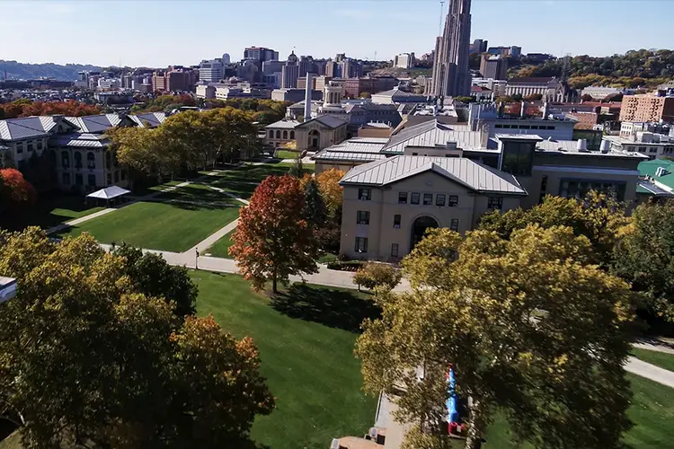 fall campus aerial shot with Cathedral of Learning in background