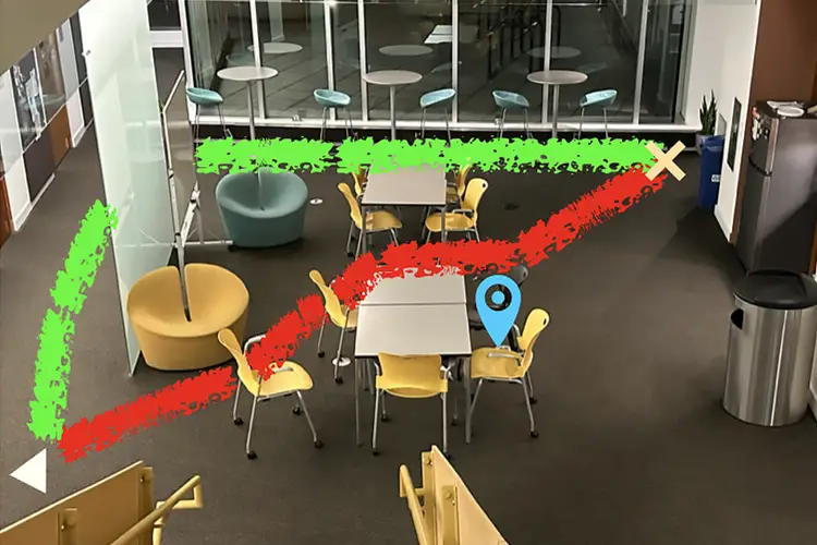 Picture of a room with two paths mapped out, a noisy one in red, and a longer and quieter one in green.