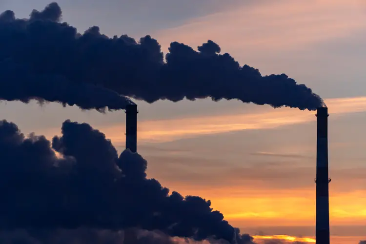 Smoking industrial zone factory chimneys.
