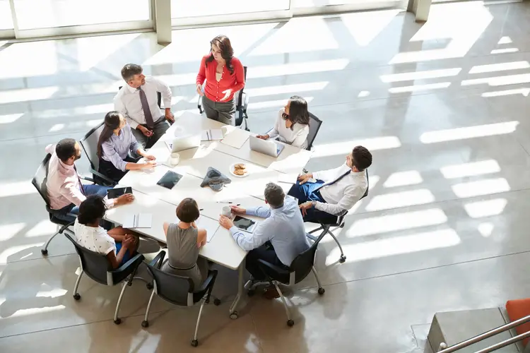 Businesspeople sitting around a table