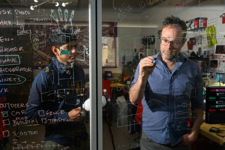 HCI professor Chris Harrison instructs a student. 
