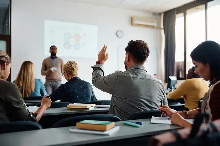 People engaging in a classroom.