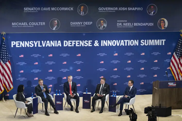 Neeli Bendapudi, president of Penn State University, U.S. Sen. David McCormick, Michael Coulter, president and CEO of Hanwha Defense USA, Danny Deep, president of General Dynamics, and Pennsylvania Governor Josh Shapiro.