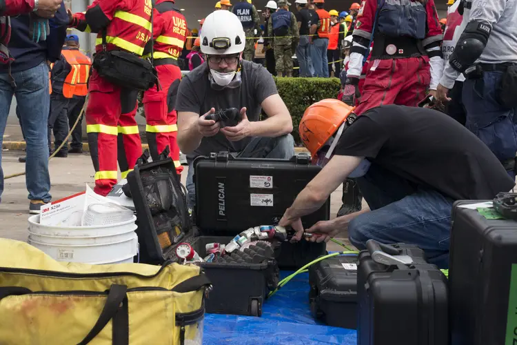 Rescue workers open snake robot case